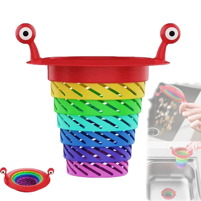 📢📢Köp 1  få 1 gratis⏰ Över 50 000 sålda! Diskhossil med monstertema, hopfällbar regnbågsdesign och extra stor kapacitet. Säg adjö till stopp i avloppet – skaffa din nu! ✅